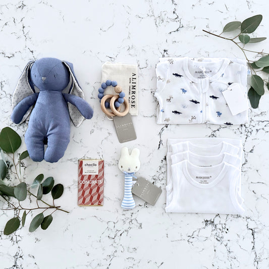 Omoiyari Hello Baby Boy Gift hamper box - blue bunny plush toy, chocolate, Maraquise growsuit, rattle and a teething ring with green gum leaves.