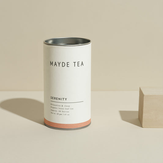 Mayde Tea canister labeled 'Serenity' on a beige background