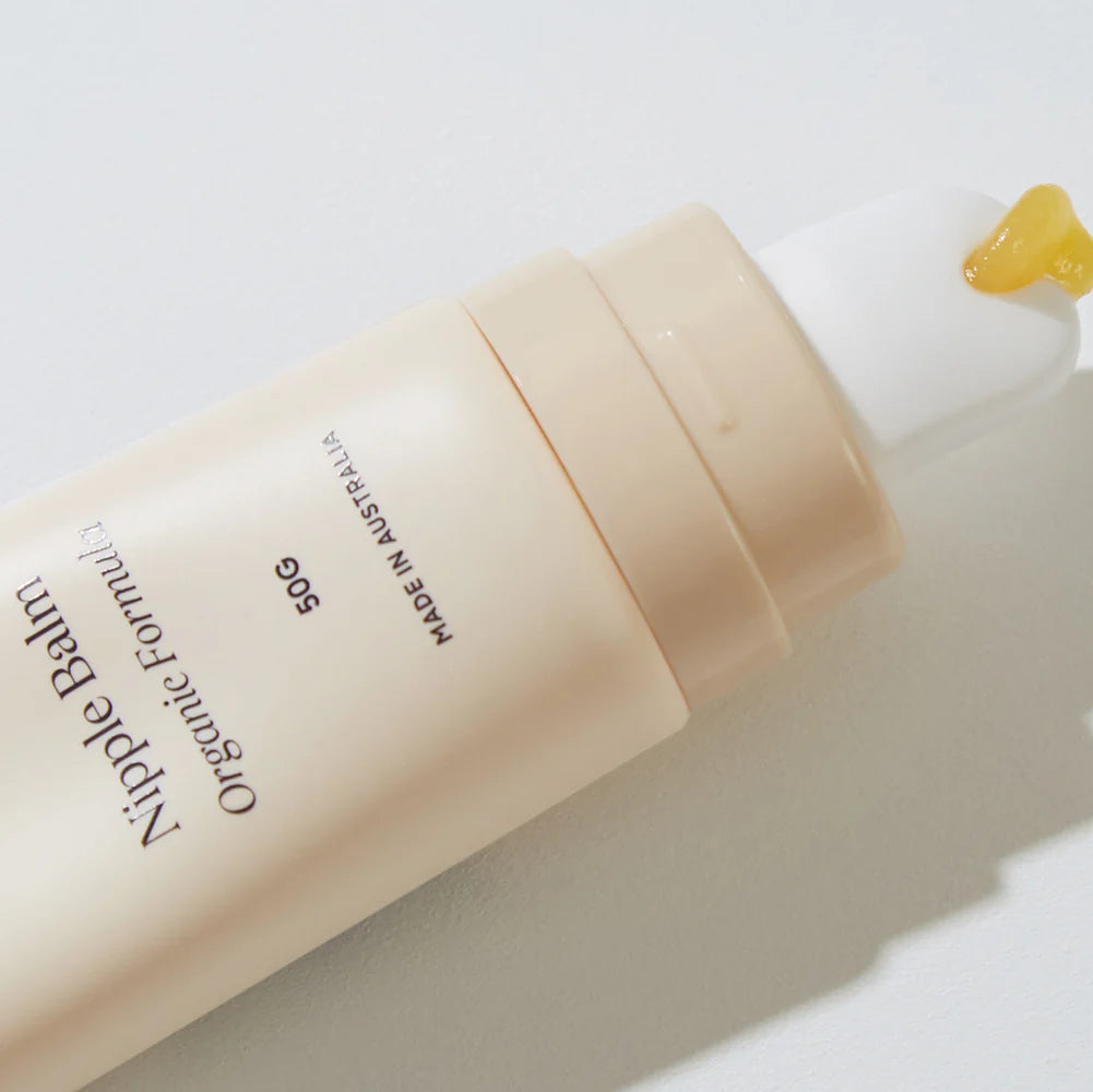 Nipple balm with a drop of balm on a white background