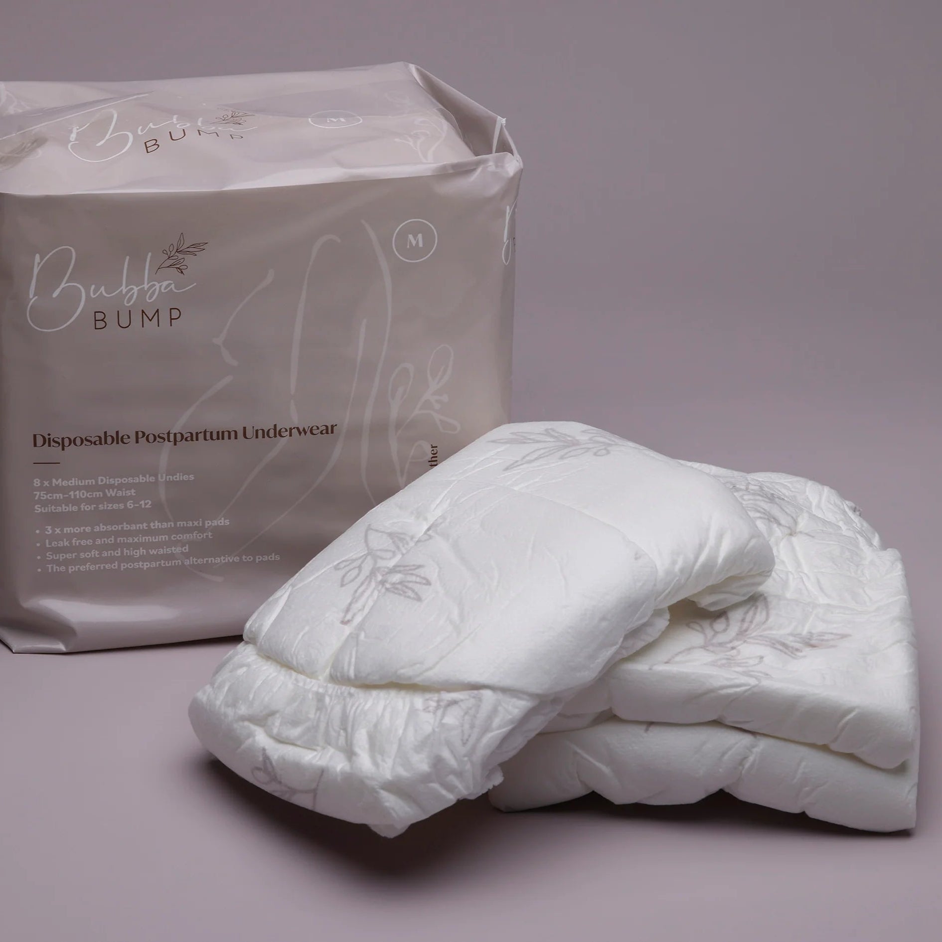 Disposable postpartum underwear with packaging on a gray background
