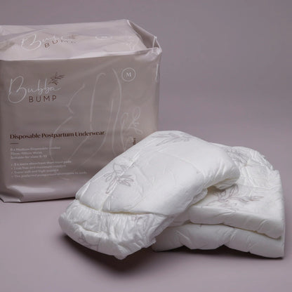 Disposable postpartum underwear with packaging on a gray background