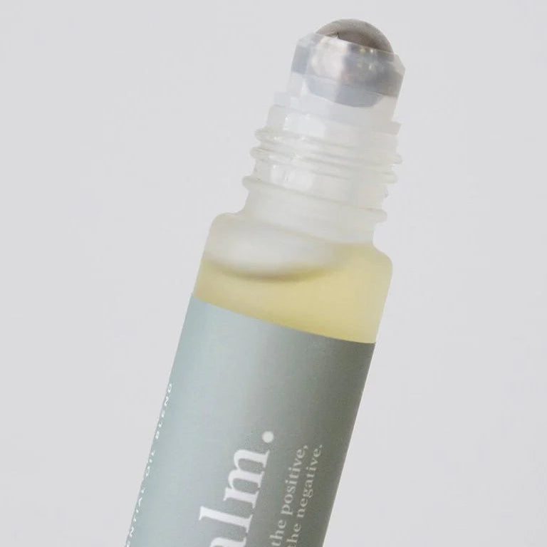 Essentials oil Roller bottle with 'calm' text on a light grey background