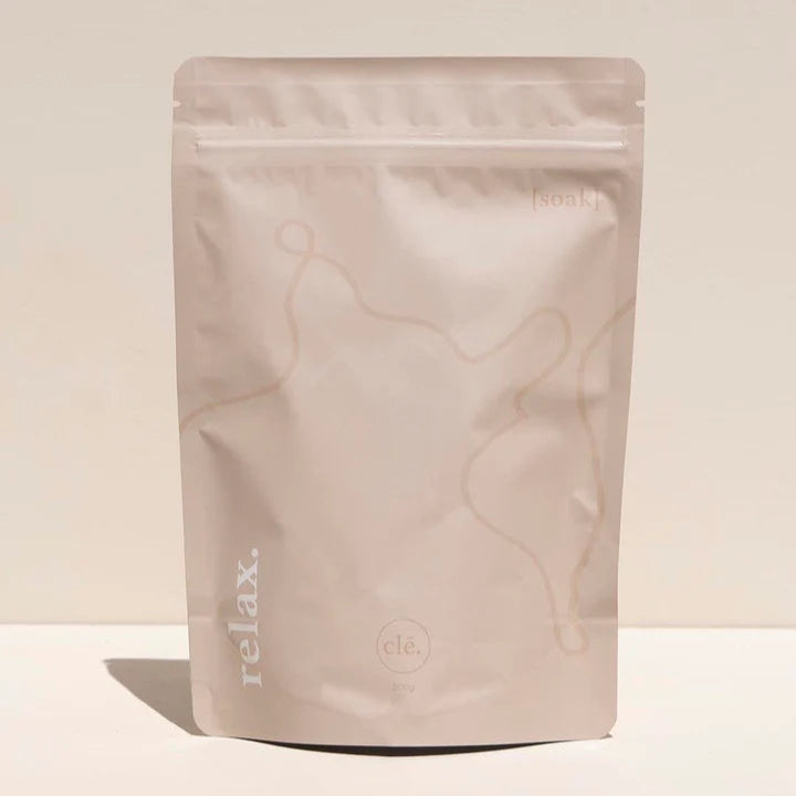 Marble-patterned packaging with 'relax.' text on a beige background