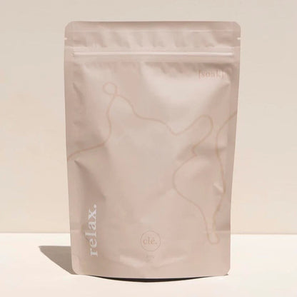 Marble-patterned packaging with 'relax.' text on a beige background