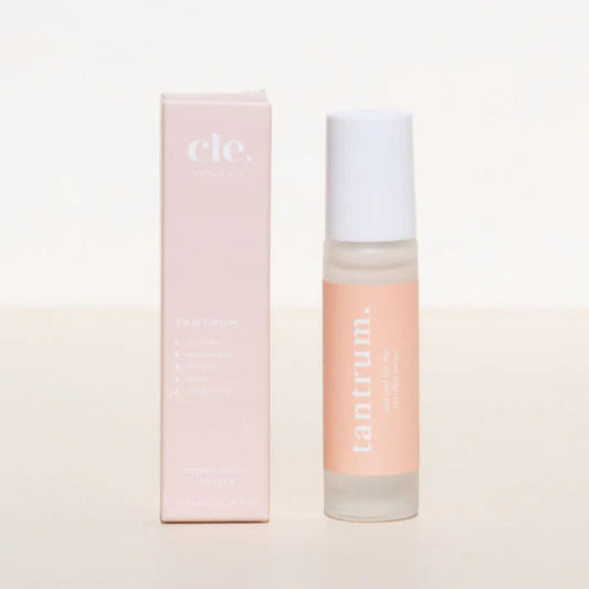 Cle Tantrum Essentials Oil Roller bottle and box on a light pink background