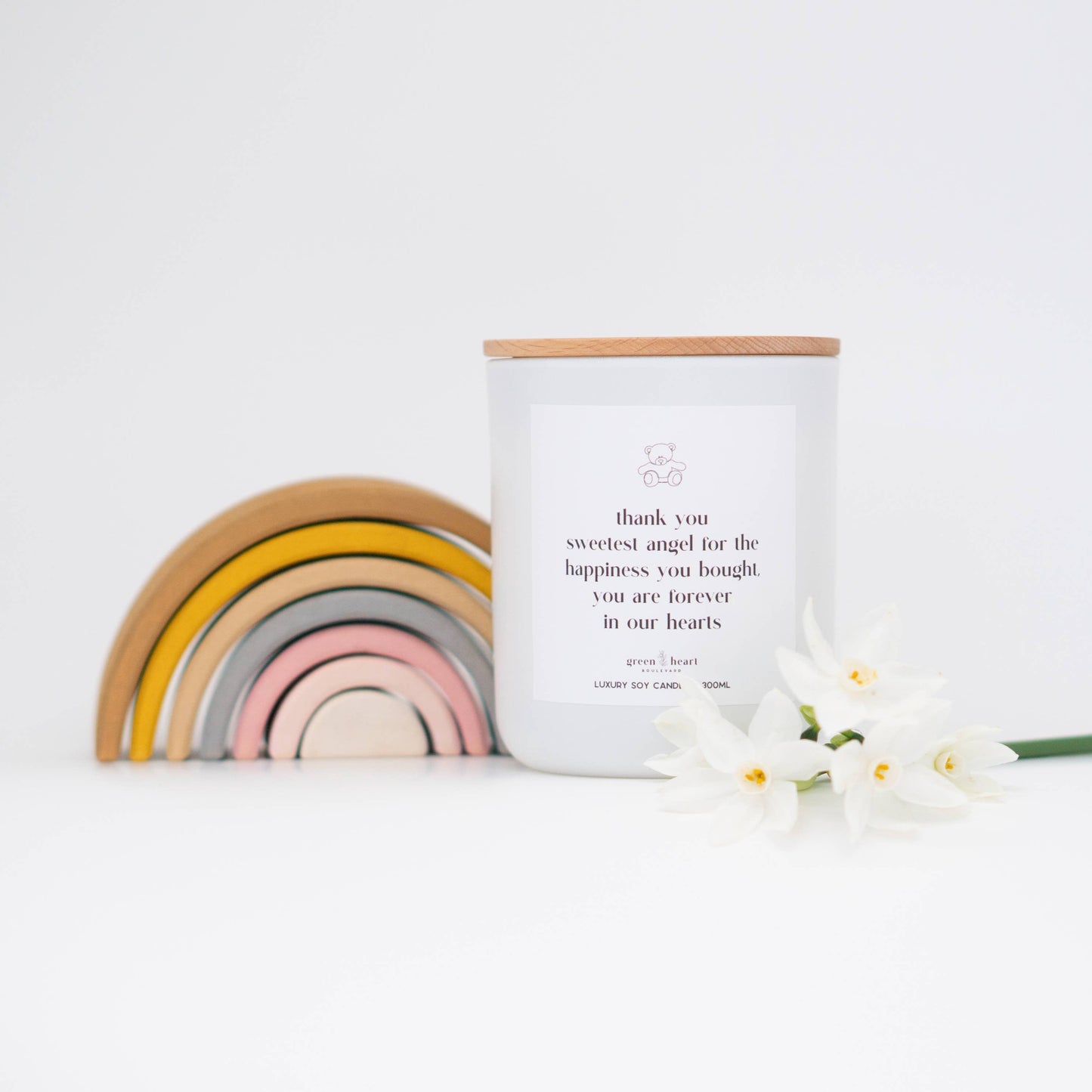 Green Heart Thank you sweet angel soy candle on table with rainbow and flower