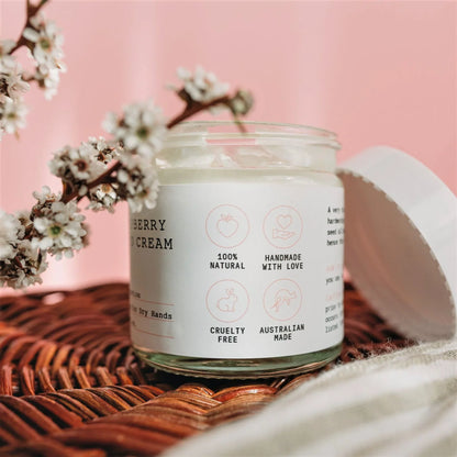 Wild Jasmine Soufflé  jar labeled 'Berry Cream' with cherry blossoms on a pink background