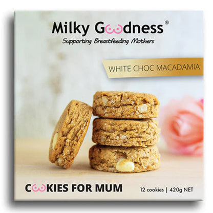 Packaging of Milky Goodness White Choc Macadamia cookies for mum with cookies and a rose in the background.