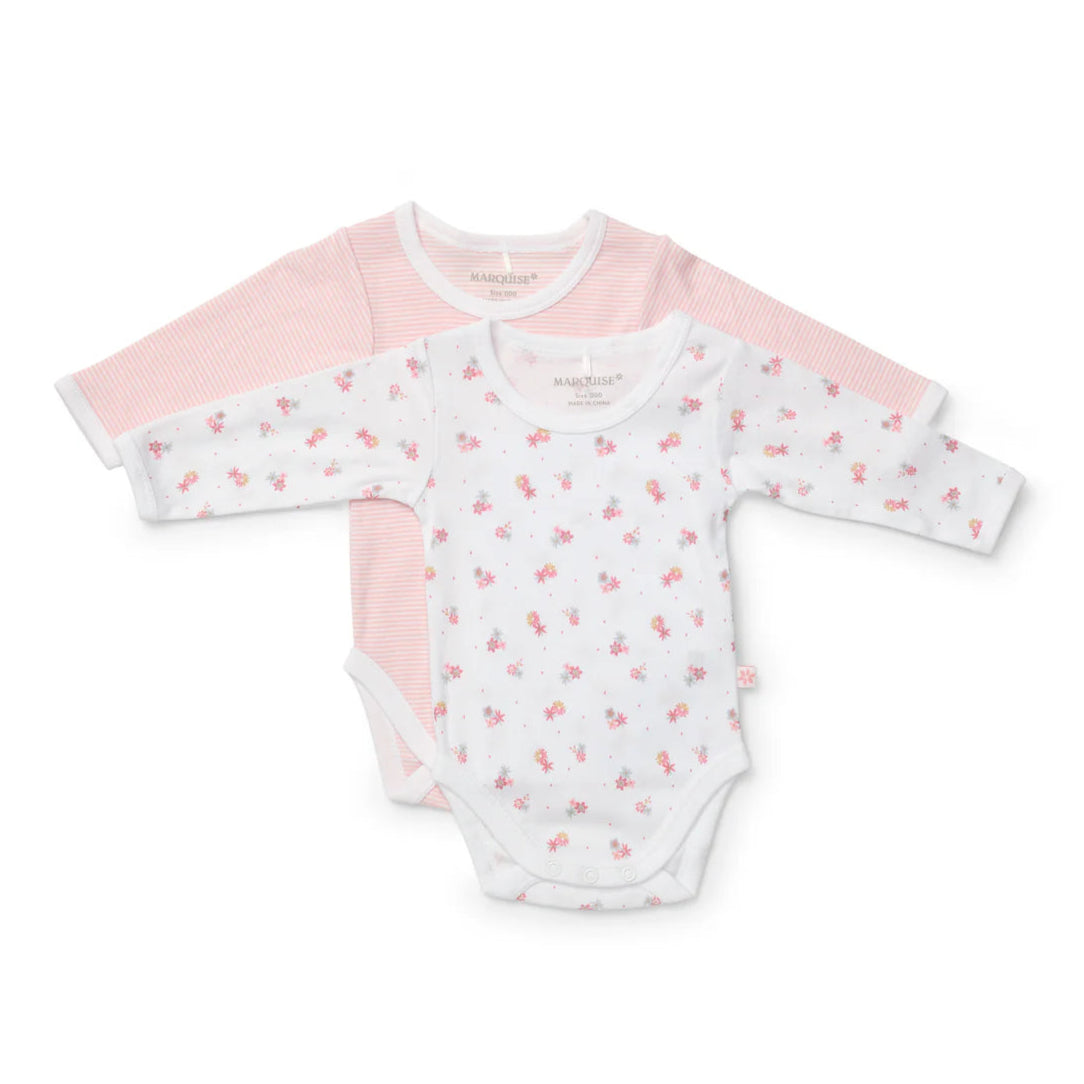 Two baby bodysuits with pink and white patterns on a white background