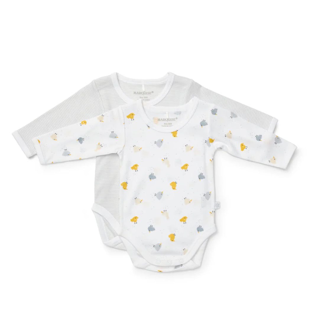 White baby onesie with small colorful patterns on a white background