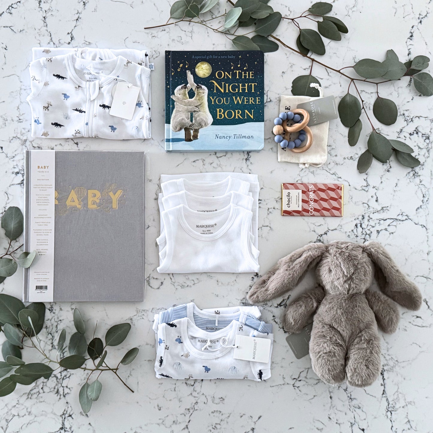 Omoiyari Hello Baby Boy Luxe Gift hamper box -  blue bunny plush toy, chocolate, Maraquise baby clothing, baby journal rattle and a teething ring with green gum leaves.