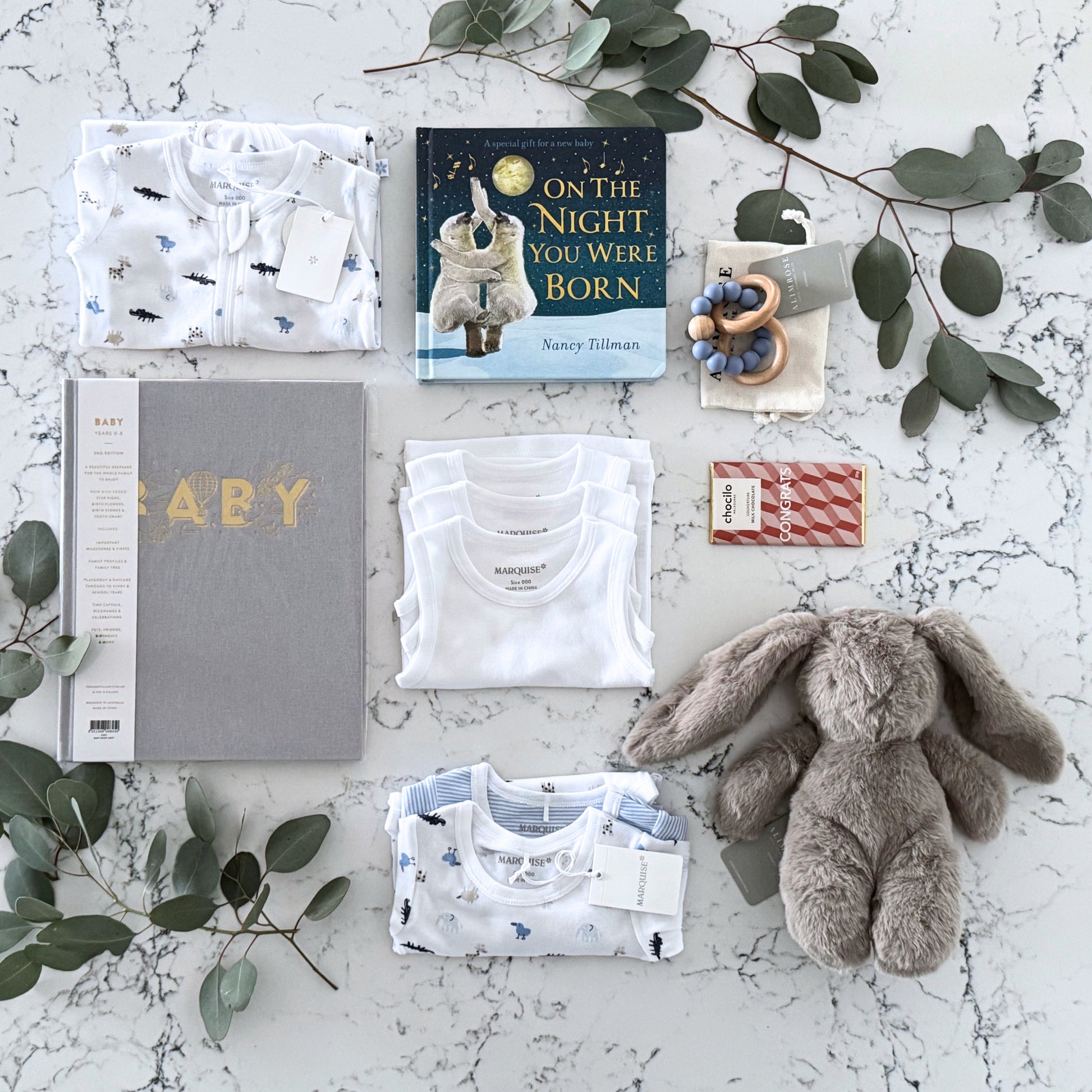 Omoiyari Hello Baby Boy Luxe Gift hamper box -  blue bunny plush toy, chocolate, Maraquise baby clothing, baby journal rattle and a teething ring with green gum leaves.