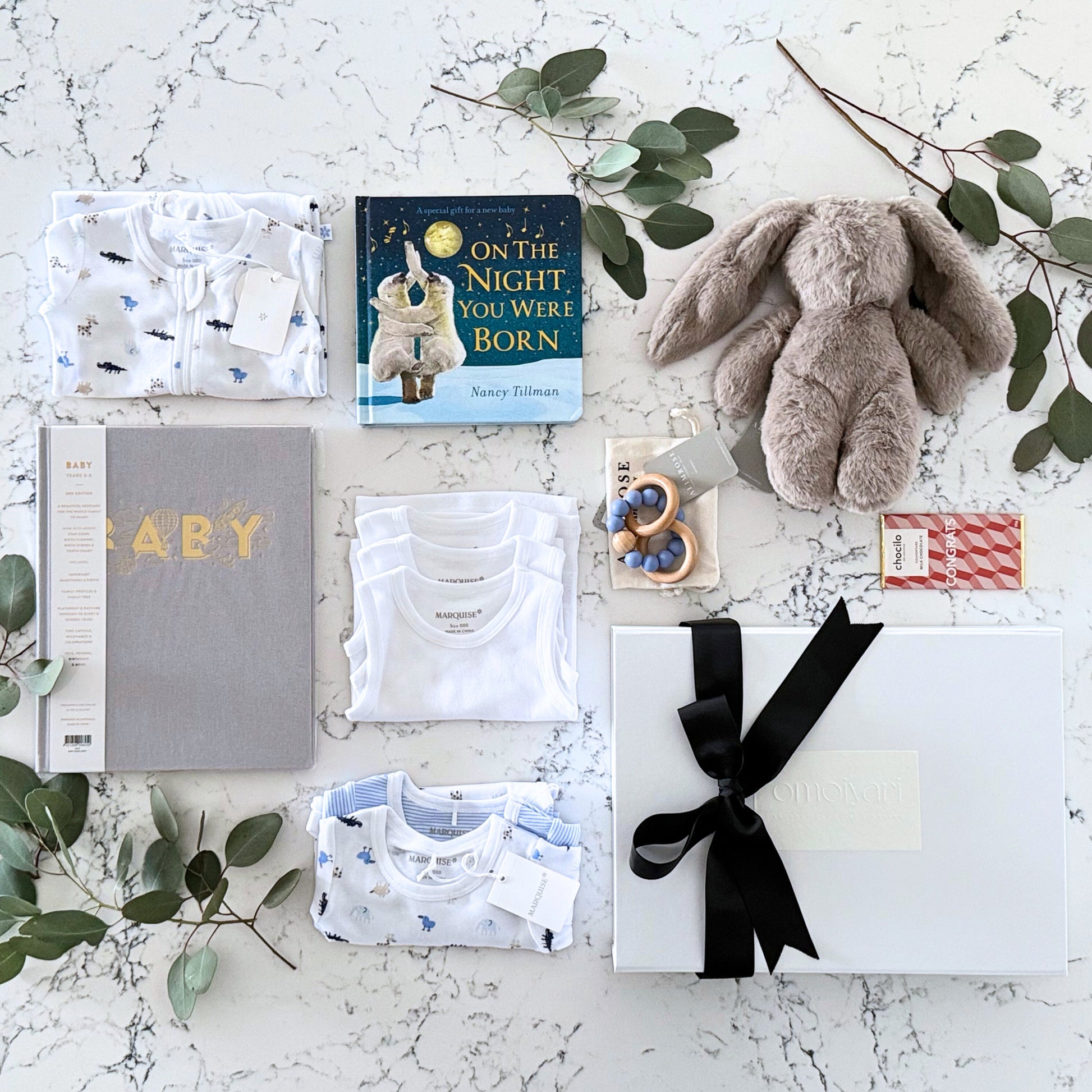 Omoiyari Hello Baby Boy Luxe Gift hamper box -  blue bunny plush toy, chocolate, Maraquise baby clothing, baby journal rattle and a teething ring with green gum leaves.