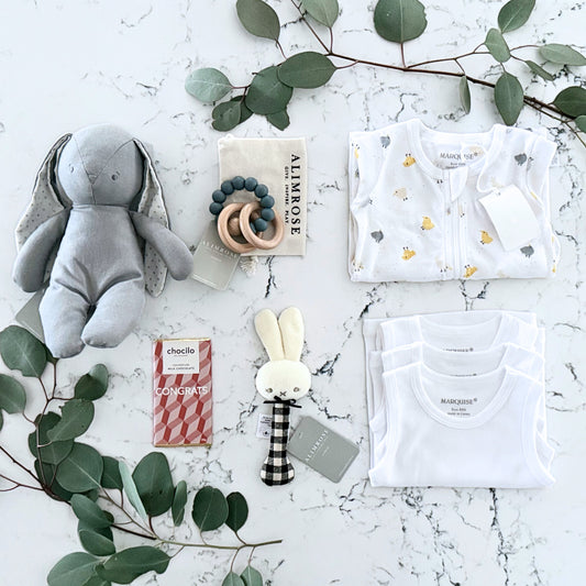 Omoiyari Hello Baby (gender neutral) Gift hamper box -  blue bunny plush toy, chocolate, Marquise growsuit, rattle and a teething ring with green gum leaves.