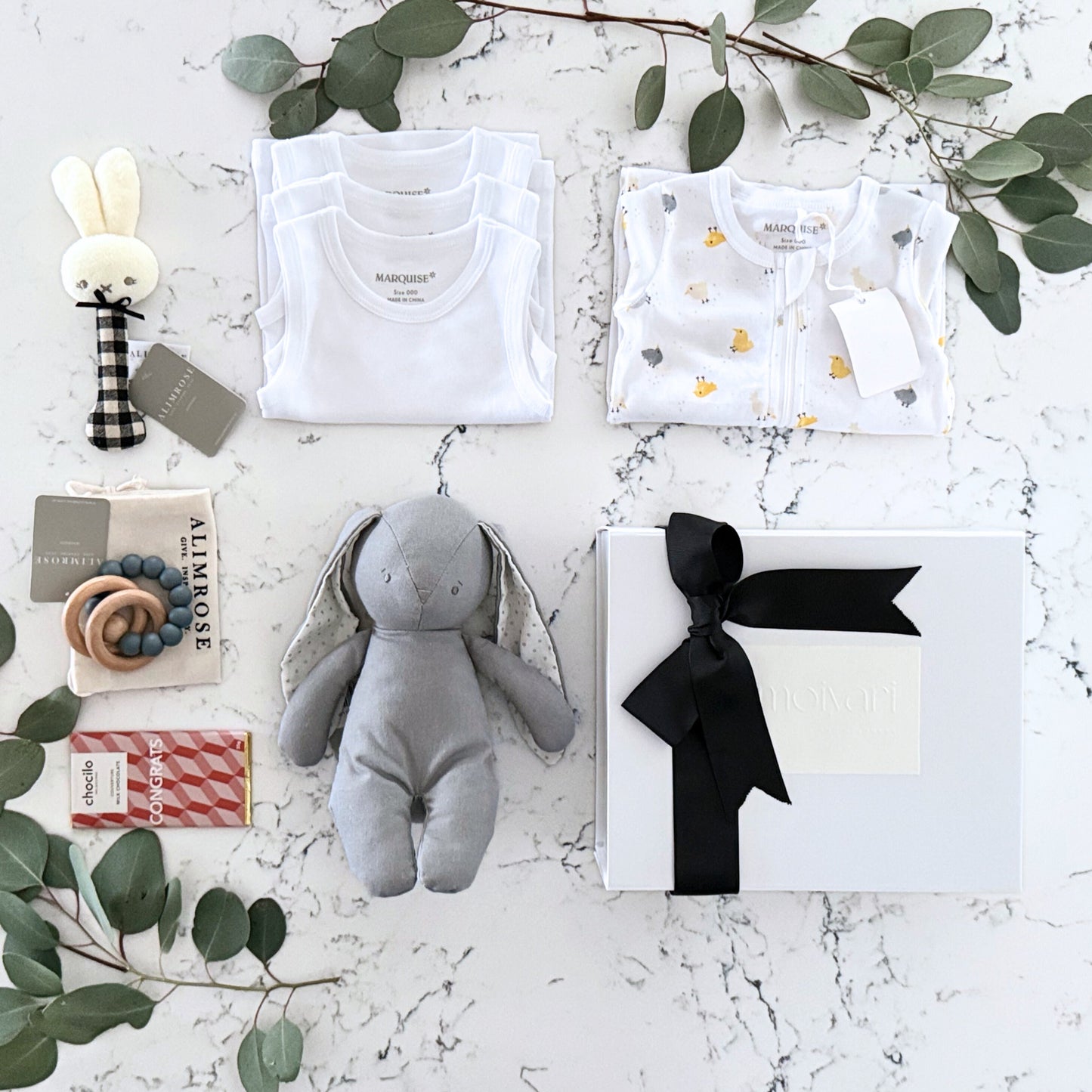 Omoiyari Hello Baby (gender neutral) Gift hamper box -  blue bunny plush toy, chocolate, Marquise growsuit, rattle and a teething ring with green gum leaves.