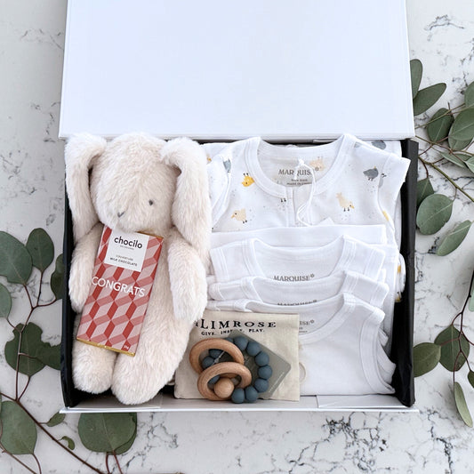 Omoiyari Hello Baby Luxe (gender neutral) Gift hamper box -  blue bunny plush toy, chocolate, Marquise growsuit, rattle and a teething ring with green gum leaves.