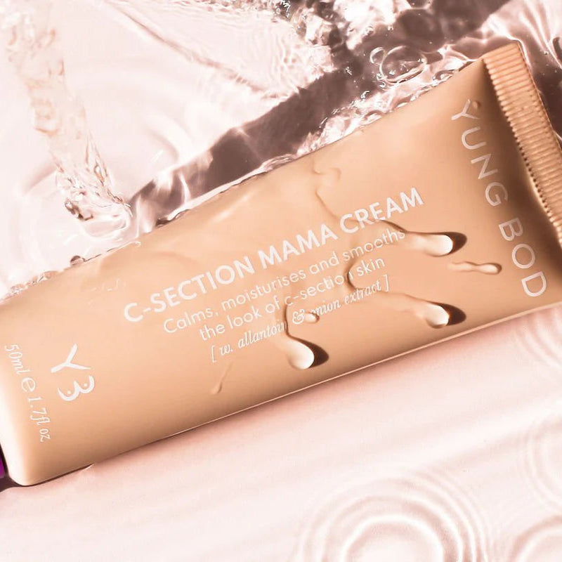 Yung Bod C-Section Mama Cream tube on a textured surface