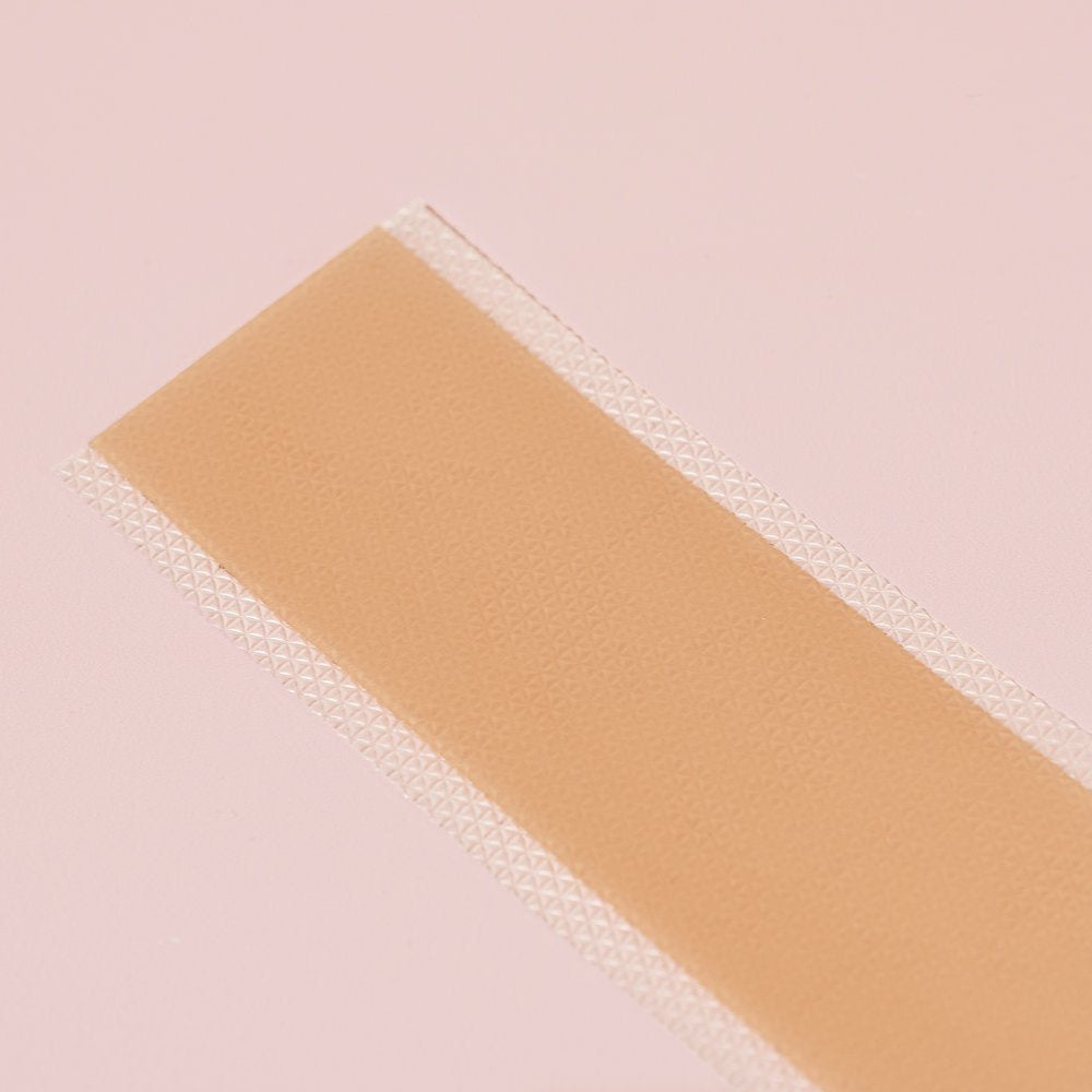 Rectangular bandage on a pink background