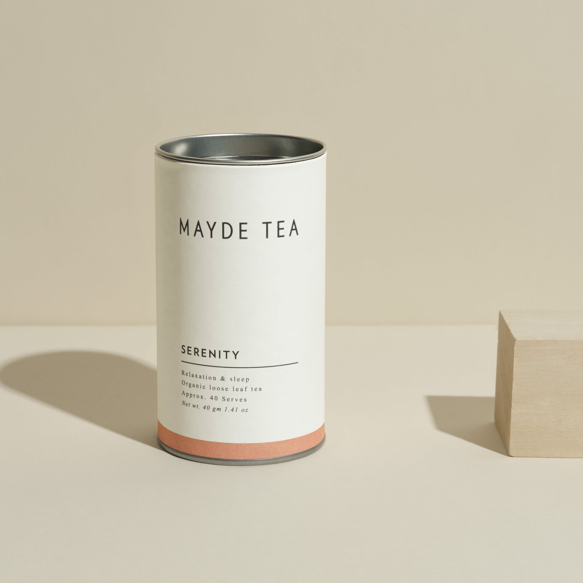 Mayde Tea canister labeled 'Serenity' on a beige background